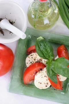 Tomatoes with mozzarella. Stock Photos