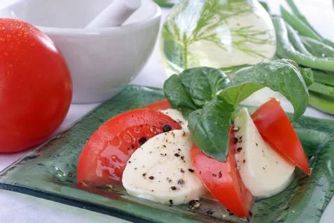 Tomatoes with mozzarella. Stock Photos