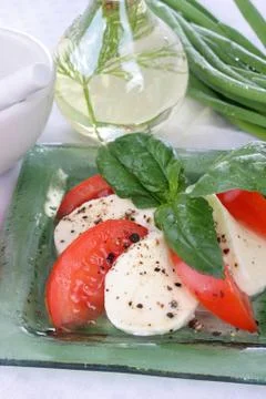 Tomatoes with mozzarella. Stock Photos