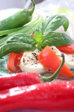 Tomatoes with mozzarella. Stock Photos