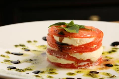 Tomatoes with mozzarella. Stock Photos