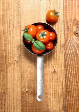 Tomatoes in an old saucepan Stock Photos