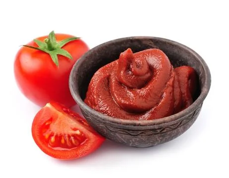 Tomatoes paste isolated closeup. Stock Photos