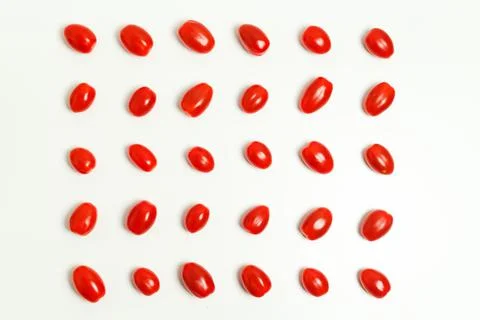 Tomatoes pattern on white background Cherry tomatoes, minimal concept Stock Photos