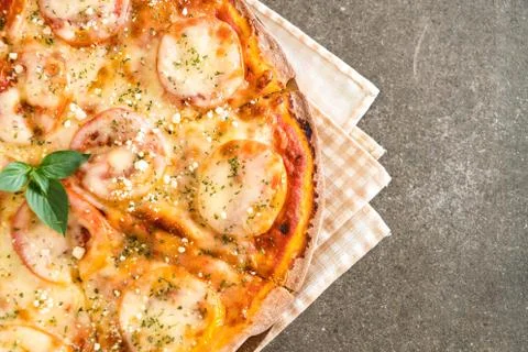 Tomatoes pizza on table Stock Photos