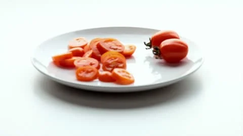 Tomatoes on a plate Stock Footage 21294390