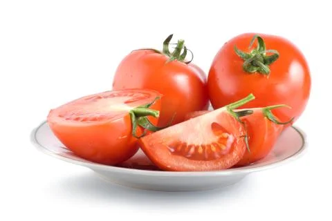 Tomatoes on a plate Stock Photos