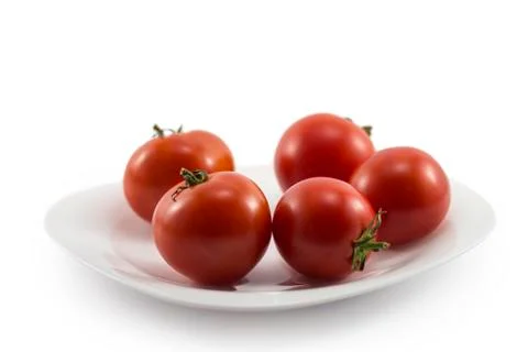.tomatoes on a plate Stock Photos