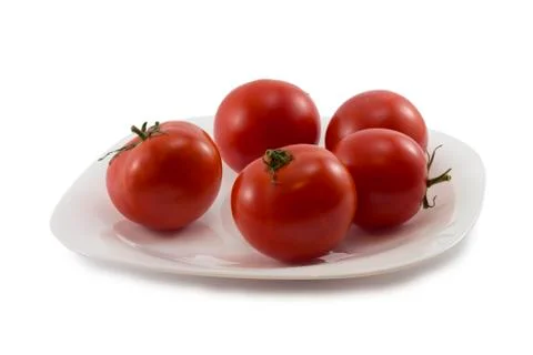 Tomatoes on a plate Stock Photos