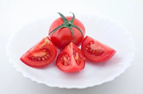 Tomatoes on a plate Stock Photos