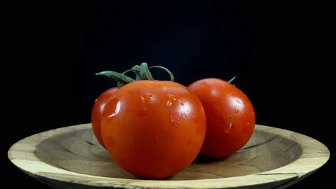 Tomatoes on plate rotate in 4K Stock Footage 137173486