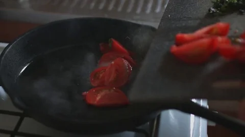 Tomatoes roasting in the pan Stock Footage 76006168