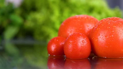 Tomatoes roll in the water Full HD Stock Footage 85216994