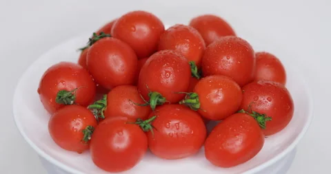 Tomatoes rotate on a plate Stock Footage 124661145