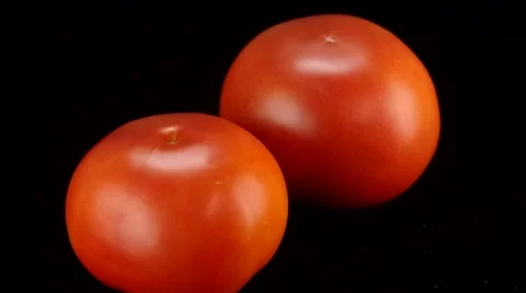 Tomatoes rotating with black background Stock Footage 54076693