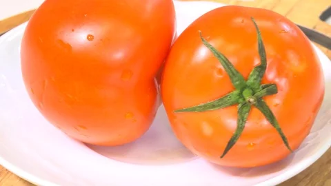 Tomatoes on a rotating plate Stock Footage