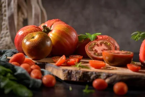Tomatoes on rustic kitchen counter Stock Photos