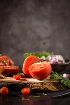 Tomatoes on rustic kitchen counter Stock Photos