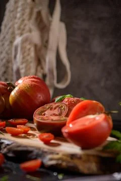 Tomatoes on rustic kitchen counter Stock Photos