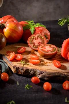 Tomatoes on rustic kitchen counter Stock Photos