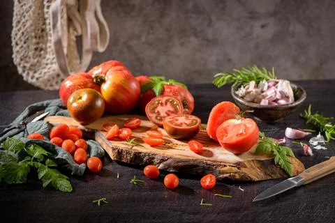 Tomatoes on rustic kitchen counter Stock Photos