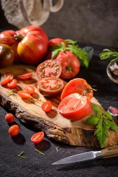 Tomatoes on rustic kitchen counter Stock Photos