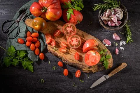Tomatoes on rustic kitchen counter Stock Photos