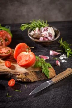 Tomatoes on rustic kitchen counter Stock Photos