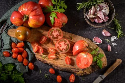 Tomatoes on rustic kitchen counter Stock Photos