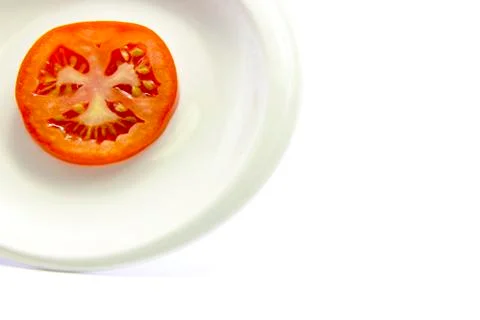 Tomatoes section sliced texture and white plate Stock Photos