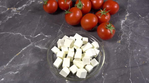 Tomatoes on a silver expensive table Stock Footage 242344334