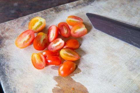 Tomatoes slice and knife Stock Photos