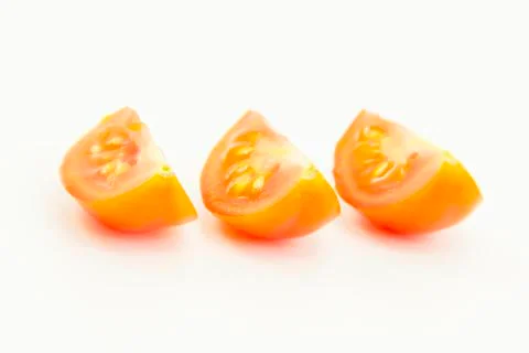 Tomatoes sliced in equal pieces Stock Photos
