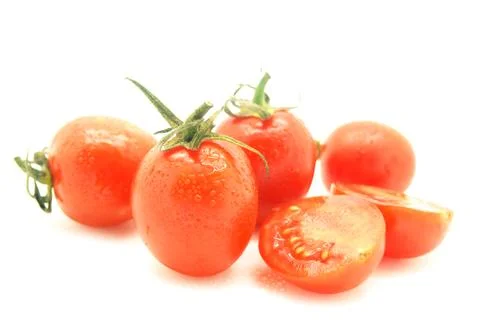 Tomatoes sliced ingredient with drop Stock Photos