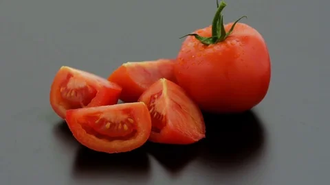 Tomatoes Sliced on Turntable - Black Background Stock Footage 75867907