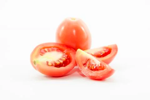 Tomatoes sliced in two size with raw material Stock Photos