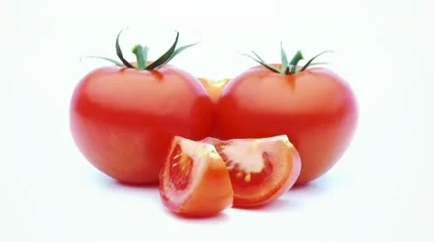 Tomatoes slized isolated loopable Stock Footage 8979681