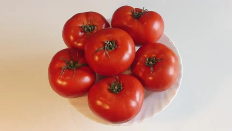 Tomatoes Spinning on a Plate Top Down Stock Footage 141914532