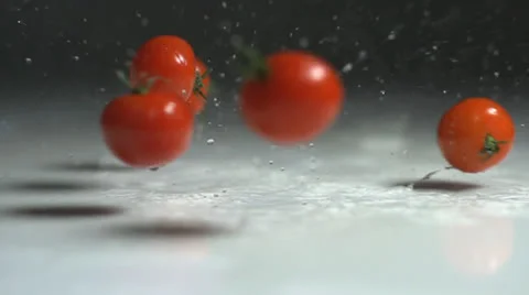 Tomatoes splashing in slow motion Stock Footage 24738427