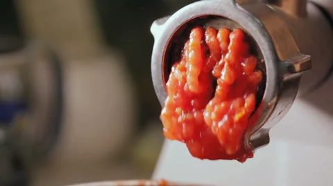 Tomatoes through a meat grinder Stock Footage 67578337