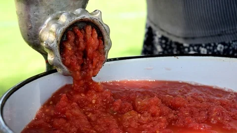 Tomatoes through a meat grinder. Stock Footage 92276739