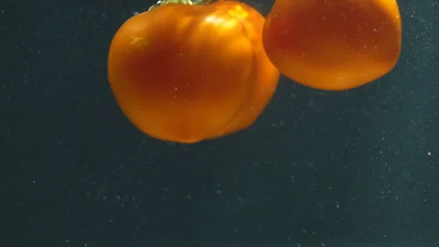 Tomatoes under water Stock Footage 115123913