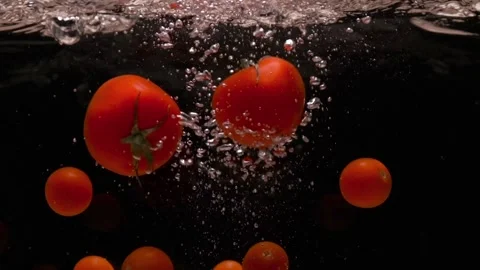 Tomatoes in water. Stock Footage 168921590