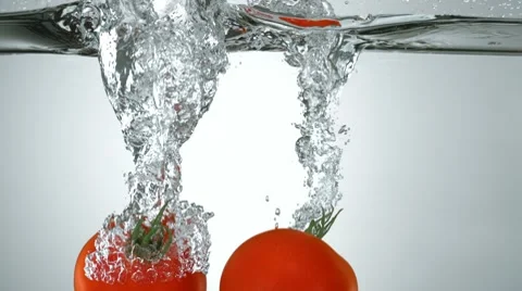 Tomatoes in water, Slow Motion Stock Footage 10700503