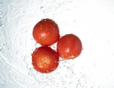 Tomatoes Water Splash Stock Photos