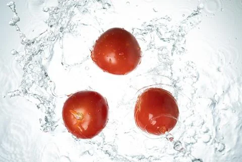 Tomatoes Water Splash Stock Photos