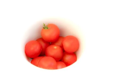 Tomatoes in a well in white background Stock Photos