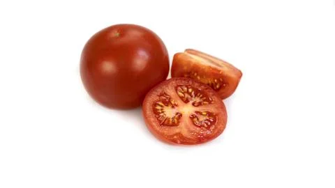 Tomatoes on a white background. A bright combination of vegetables for a healthy Stock Photos
