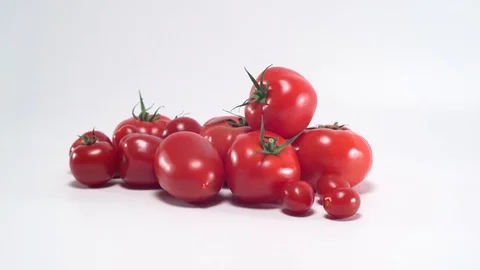 Tomatoes on white background, panning 스톡 동영상 75776709