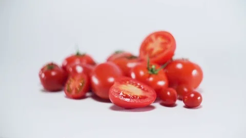 Tomatoes on white background, panning, shallow Depth of field 스톡 동영상 75777965